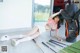 A woman laying on the floor next to a golf bag.