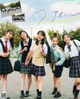 A group of young women in school uniforms posing for a picture.